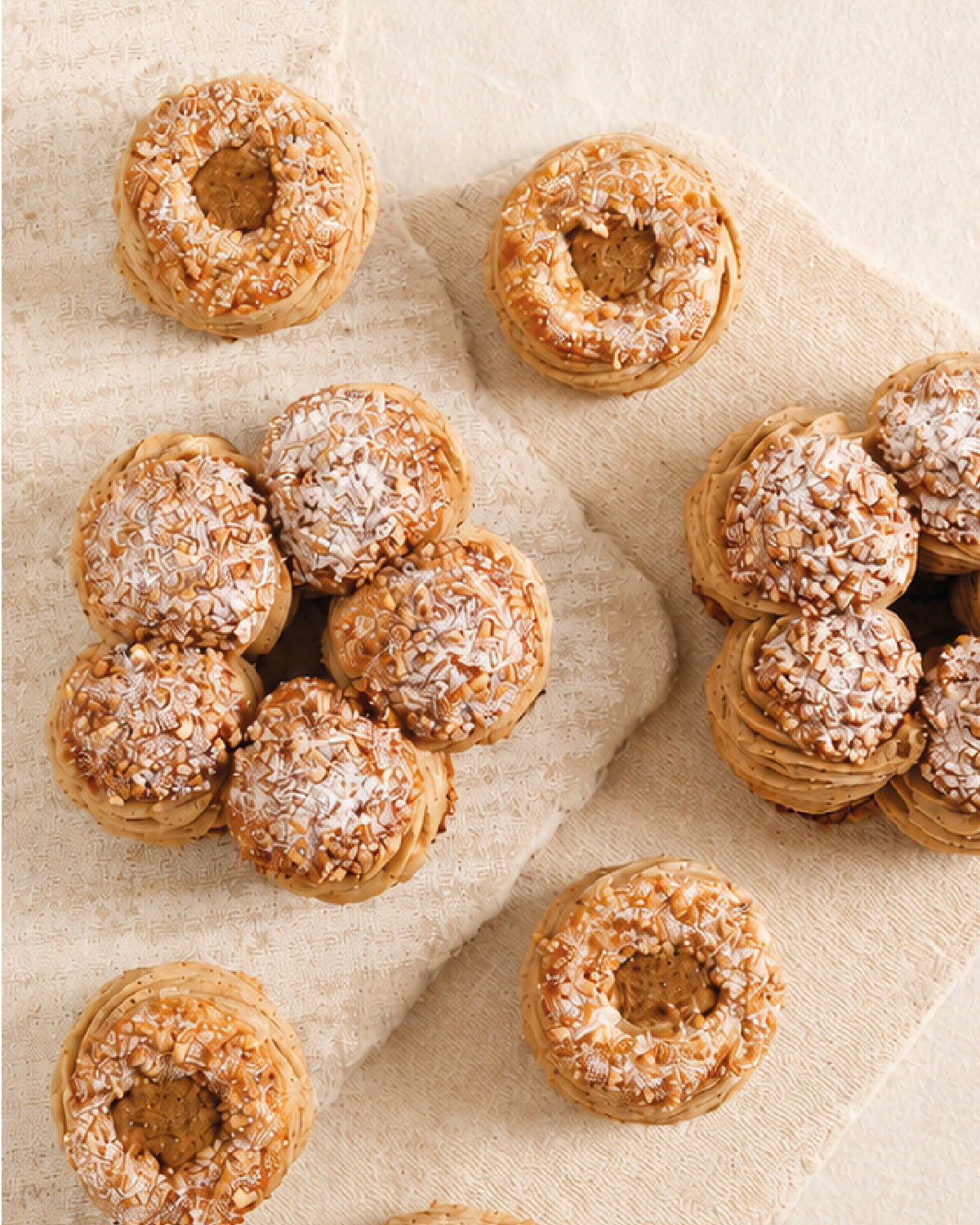 Donut holes with a sugar coating on a beige fabric background